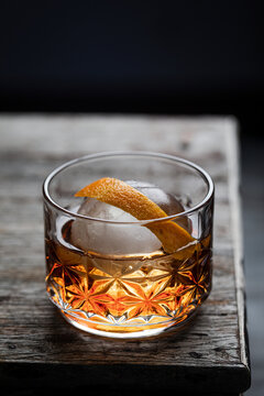 Bourbon Chambord cocktail on wooden surface