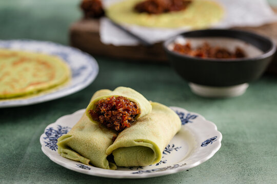 Kueh Dadar filled with sweet coconut palm-sugar mixture