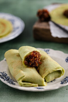 Kueh Dadar filled with sweet coconut palm-sugar mixture