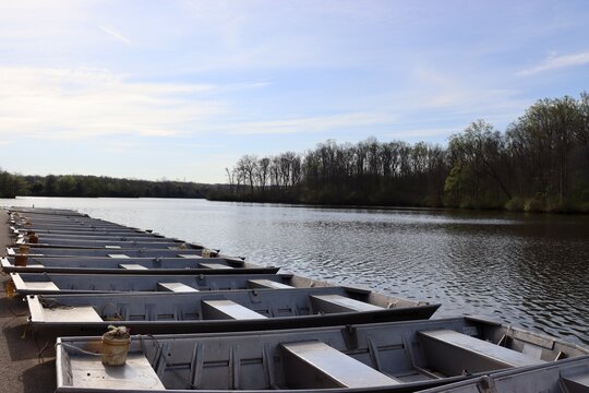 The row of boats at the lake on a sunny day.
