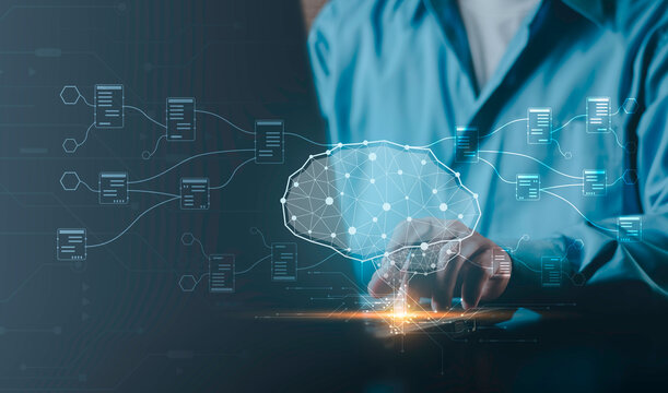 Concept of big data analytics, machine learning, data science processing and futuristic cloud computing technology. Human hand on laptop with neural network brain and connected database nodes.