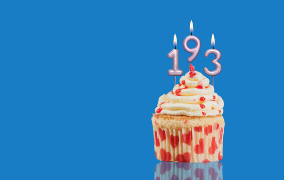 Birthday Or Anniversary Cupcake With Lit Candles; Candles Forming The Number 193