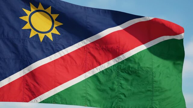 Namibian flag waving in sky