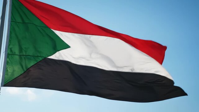 Sudan flag waving in sky