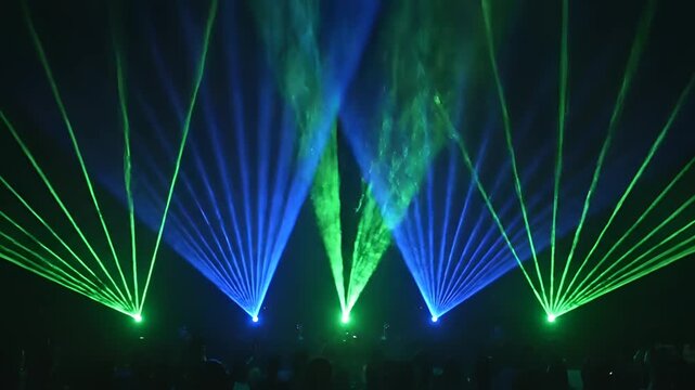 Dynamic Laser Light Show Displaying Vibrant Blue and Green Beams.