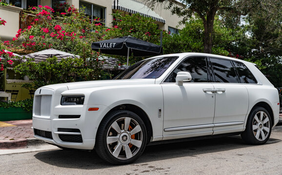 Miami, Florida, USA - July 12, 2025: Luxury SUV car Rolls Royce Cullinan. Car Rolls Royce Cullinan parked. White car, side view. 2023 Rolls Royce Cullinan luxury SUV car.