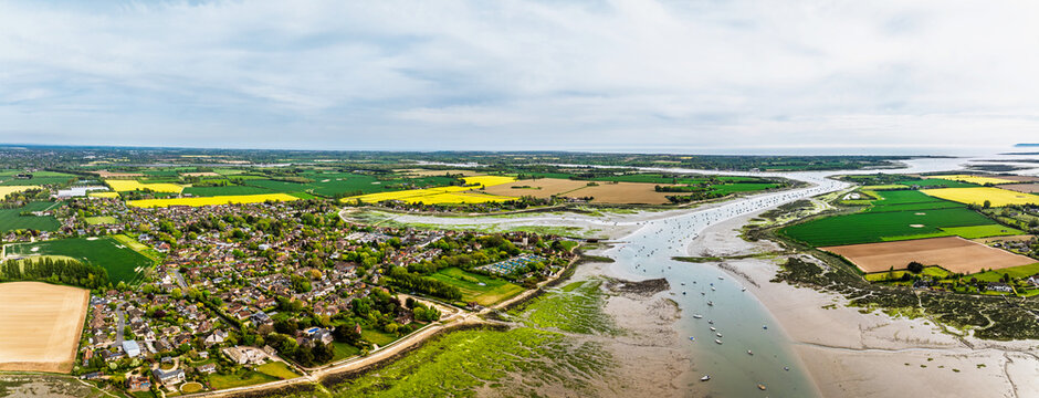 Fields and Farms over Bosham Quay from a drone at low tide, Chichester Harbour National Landscape, Chichester, West Sussex, England	
