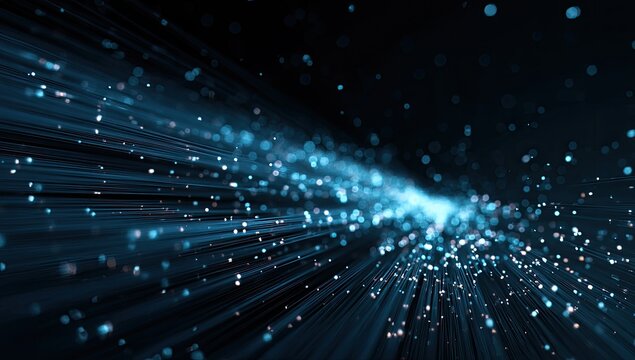 Abstract explosion of glowing blue particles and light rays in dark space