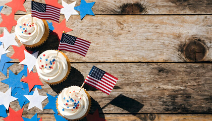 Obraz premium Patriotic cupcakes with american flags and star confetti on a rustic wooden background