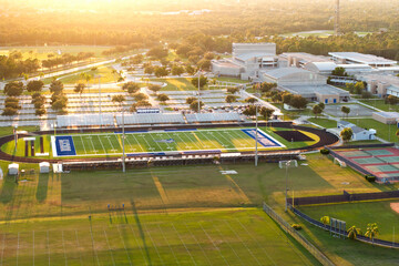 Fototapeta premium Sports facilities at public school in North Port, Florida. American football stadium sport infrastructure. North Port, USA - May 26, 2023.