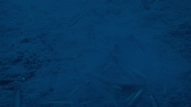 Smoke And Bullets On Sand In The Dark