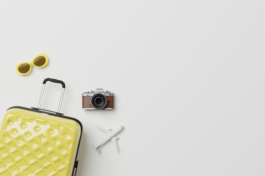 Travel accessories with suitcase on minimal white background