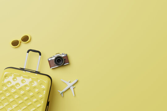 Summer travel accessories flat lay on yellow background