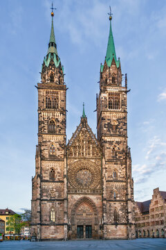 Gothic west facade of St. Lorenz Church with twin towers in Nuremberg, Germany. Exterior view, medieval architecture style