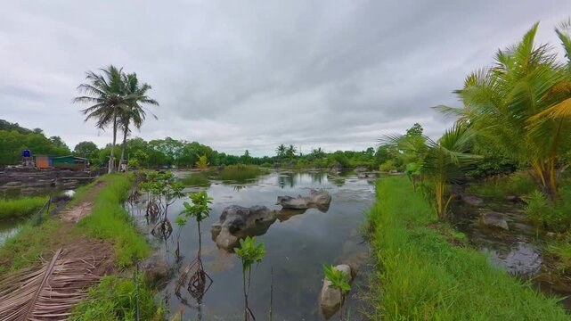 Scenic Landscape of Taman Batu Kampung Laku Karst Stone Park with a Reflection Lake Mangrove Trees and Limestone Rock Formations in Tana Toraja South Sulawesi Indonesia 4K Footage