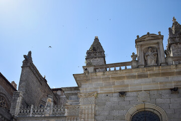 Obraz premium Ornate Gothic Cathedral Spires Against Blue Sky in Segovia Spain