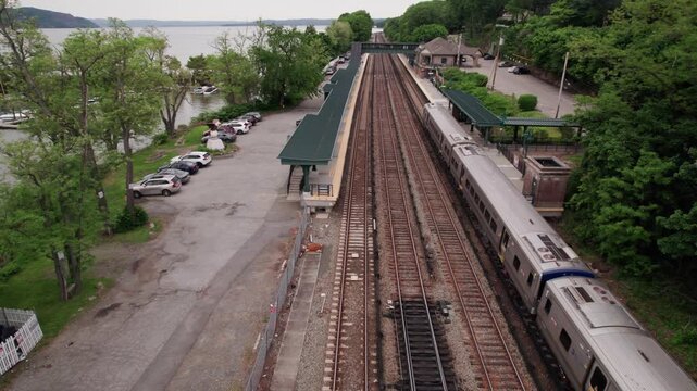 Aerial View of a Commuter Train Traveling Along the Hudson River Station