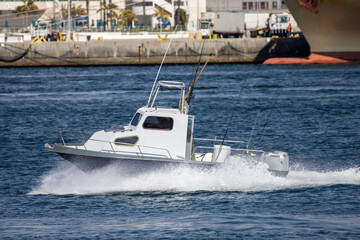 Fototapeta premium A small speed boat with fishing rods.