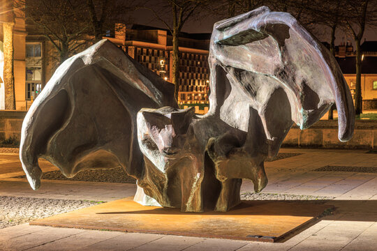 Illuminated Abstract Bronze Winged Sculpture in a Public Square at Night in Orl&eacute;ans, France