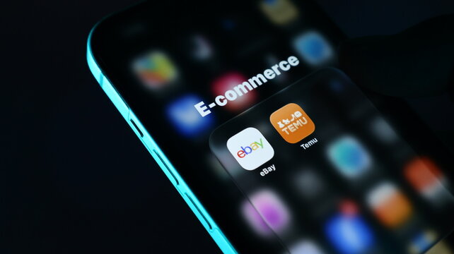 Smartphone screen displaying ecommerce apps including ebay and temu icons