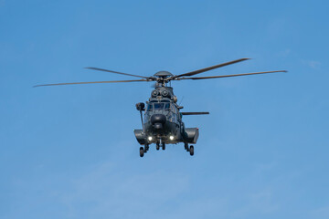 Fototapeta premium Black painted modern military transport helicopter in Hungary