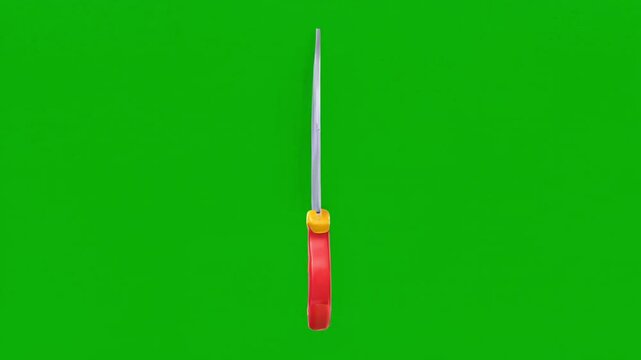 Cartoon knife spinning animation on green screen background with 3D render rotating weapon model