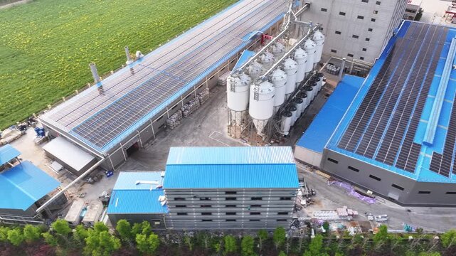 Blue roof installed with solar photovoltaic panels for green energy generation in an industrial park