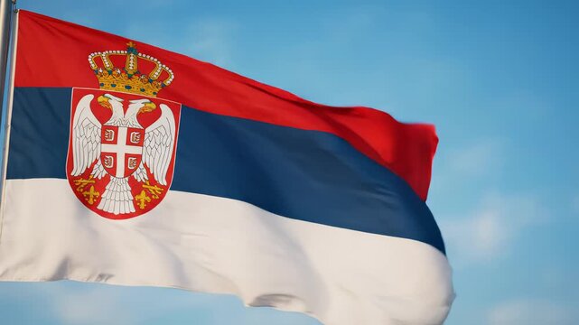 Serbian flag waving in sky
