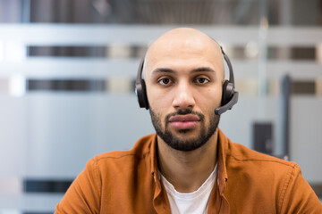 Fototapeta premium Customer service agent wearing headset providing online support