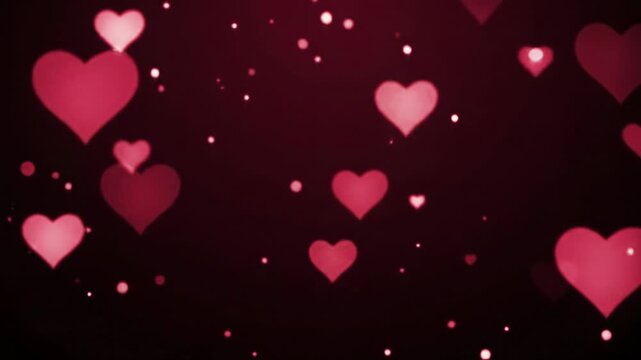 Luminous, ruby red heart-shaped particles float upwards with bokeh and bloom against a dark crimson to black gradient background, captured with cinematic drift. Romantic dreamlike atmosphere