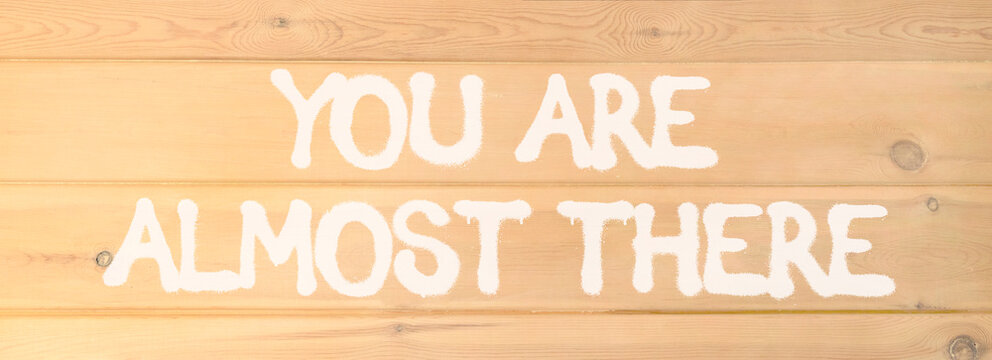 You are almost there words symbol. Concept words You are almost there on beautiful wooden wall. Beautiful wooden wall background. Business You are almost there motivational support concept. Copy space