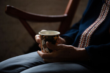 Elderly hands holding paper cup. © Rawpixel.com