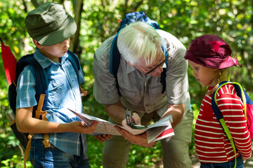 Family hiking adventure map reading