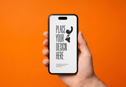 Close-up of a hand holding a smartphone mockup with a blank screen isolated on a bright orange background
