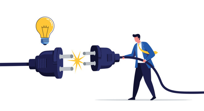 Proactive businessman connecting large electrical plugs under a bright lightbulb to symbolize making a business connection or lighting an idea.