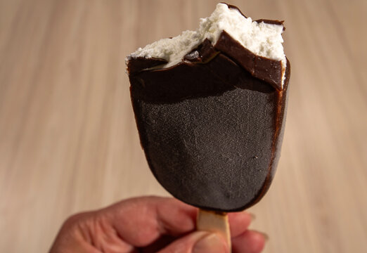 A close-up of a popsicle ice cream with a piece bitten out