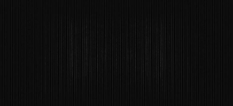 Abstract seamless industrial corrugated black dark metal sheet texture with a gray and white striped pattern backdrop