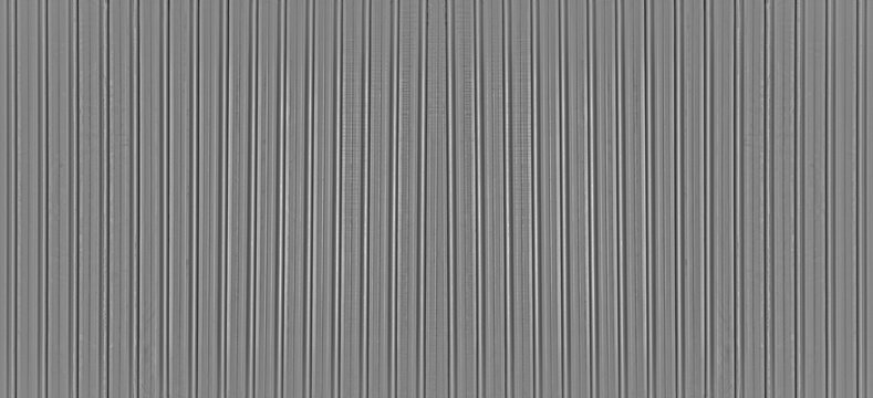Abstract seamless industrial corrugated silver metal sheet texture with a gray and white striped pattern backdrop