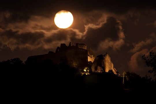 ruins of a castle by full moon in Central Europe