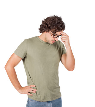 Wistful young man, keeps one hand to forehead and the other to hips, hard thinking expression isolated on transparent background with copy space