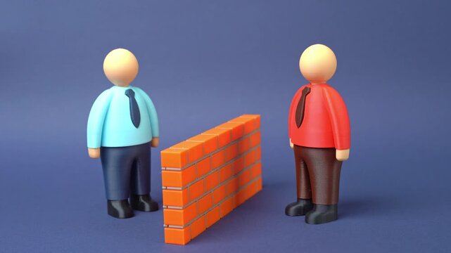 Two people separated by a brick wall. Misunderstandings and language barriers. Stereotypes. Finding common ground and gaining trust. Social conflict, isolation, cross-cultural understanding
