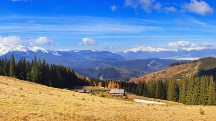 Shepherds dwellings and spring pastures on Kukul Ridge near Pid-Berdy mountain in the Ivano-Frankivsk region, with the Chornohora and Svydovets Carpathian ranges behind. © rustamank