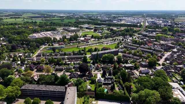 Aerial view of a dutch town with train station and suburbs