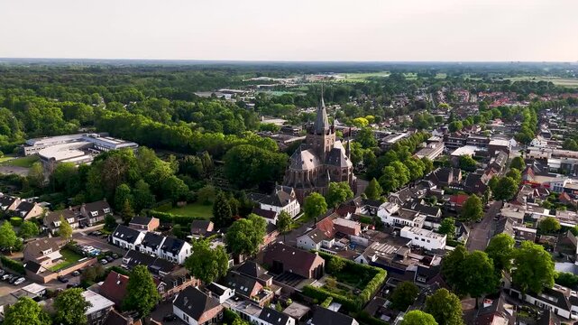 Aerial view flying over a small european town with a church