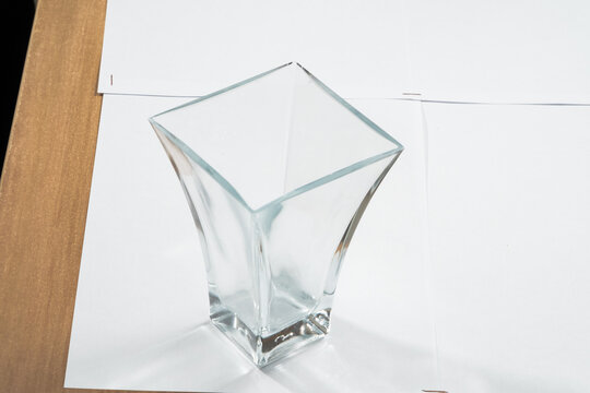 Empty glass carafe isolated on white
