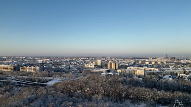 Aerial View of Snow Covered Munich Cityscape at Golden Hour, Germany, Winter Urban Landscape