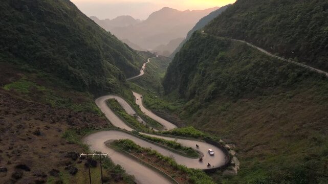 Aerial View Of the Winding Tham Ma Mountain Pass In Ha Giang Province In Vietnam - Ha Giang Loop Drone Shot at Sunset.