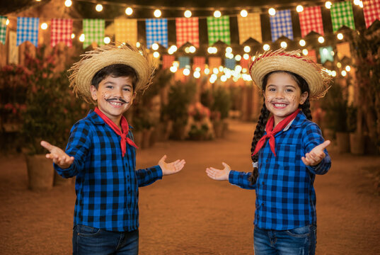 happy couple of children in traditional Brazilian Festa Junina, smiling and inviting to the party. brazilian couple,arraial, festa de s&atilde;o jo&atilde;o. boyfriend and girlfriend.free space.
