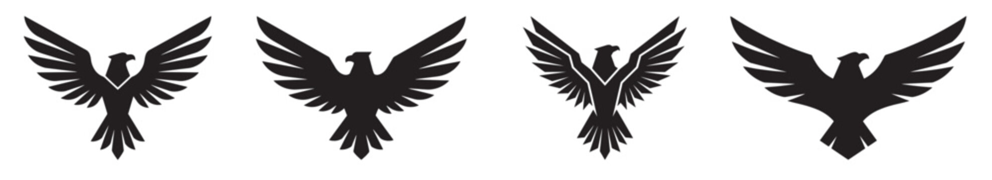 Four black bird silhouettes in flight on white background