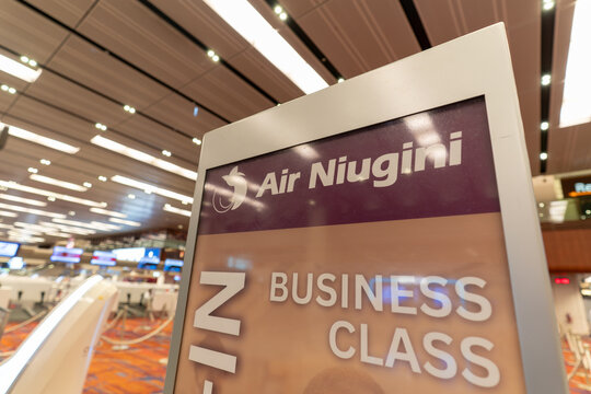 Air Niugini business class check in sign at Changi Airport